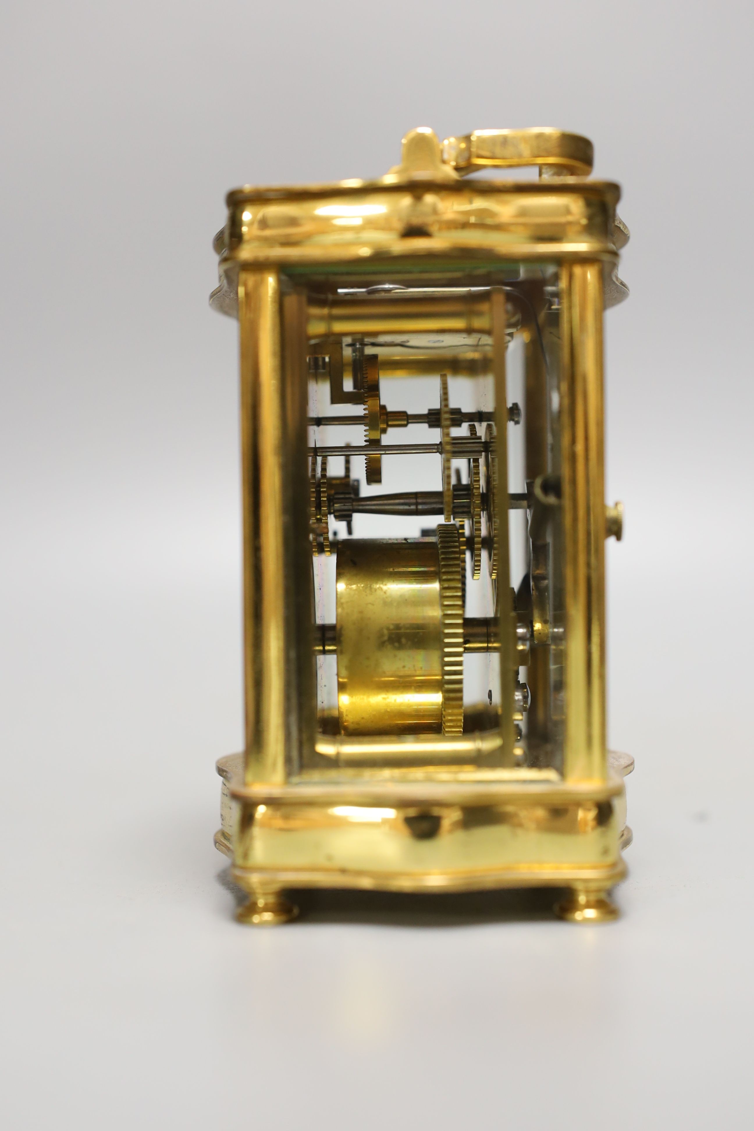 A French brass cased carriage timepiece with case. 11cm